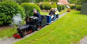 ray and Dave enjoying a ride behind Isabel driven by Keith with Prospero following